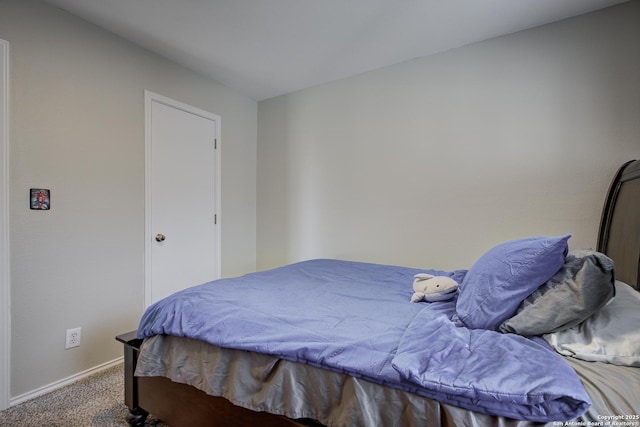 carpeted bedroom featuring baseboards