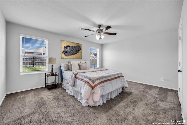 bedroom featuring a ceiling fan, carpet flooring, and baseboards