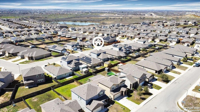 aerial view featuring a residential view and a water view