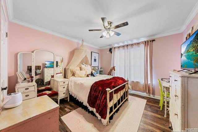 bedroom featuring ornamental molding, dark wood-type flooring, and ceiling fan