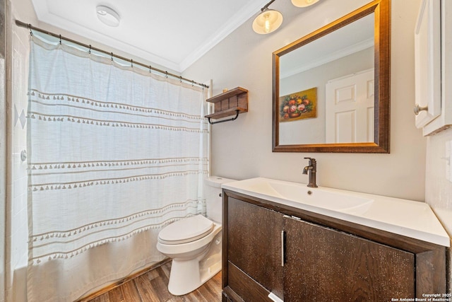 bathroom featuring crown molding, a shower with shower curtain, toilet, vanity, and wood finished floors