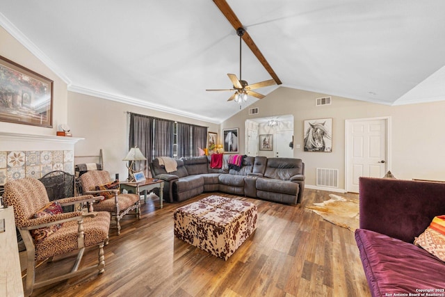 living area featuring visible vents, lofted ceiling with beams, and wood finished floors