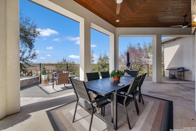 view of patio / terrace with outdoor dining space, area for grilling, and a ceiling fan