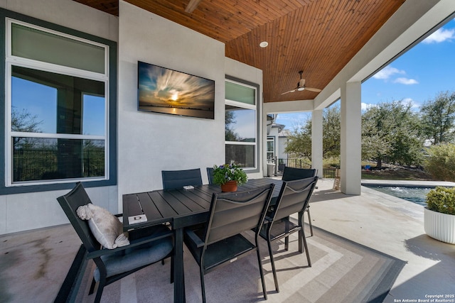 view of patio featuring a ceiling fan and outdoor dining area