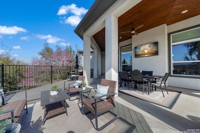 view of patio / terrace featuring an outdoor hangout area, a ceiling fan, and outdoor dining space