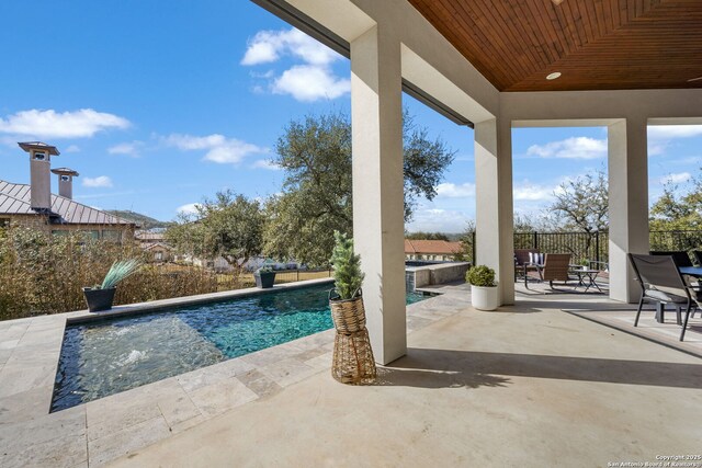 view of pool featuring a patio and a fenced in pool