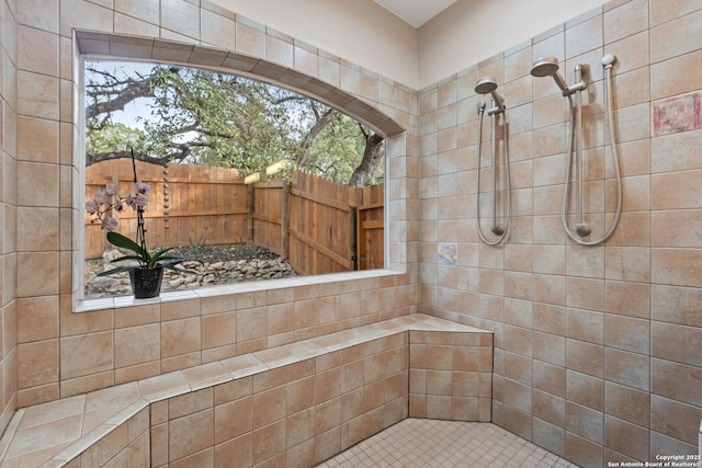 full bath featuring a tile shower