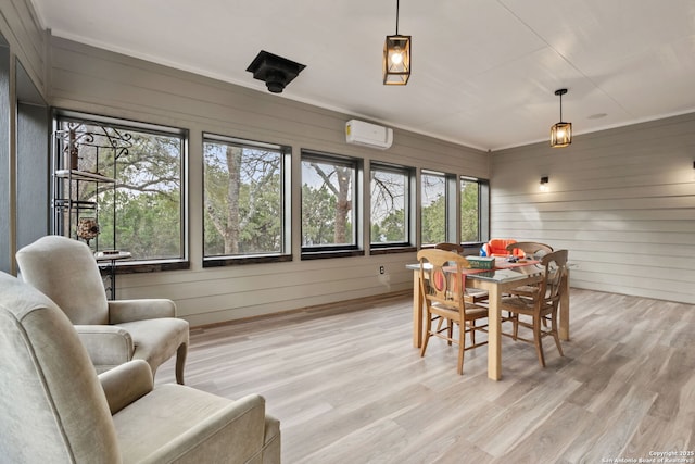 sunroom with a wall mounted air conditioner