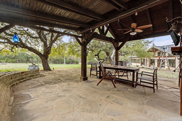 view of patio with a ceiling fan and outdoor dining space