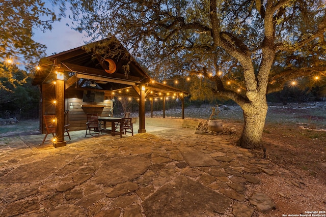 view of property's community featuring a patio and a gazebo