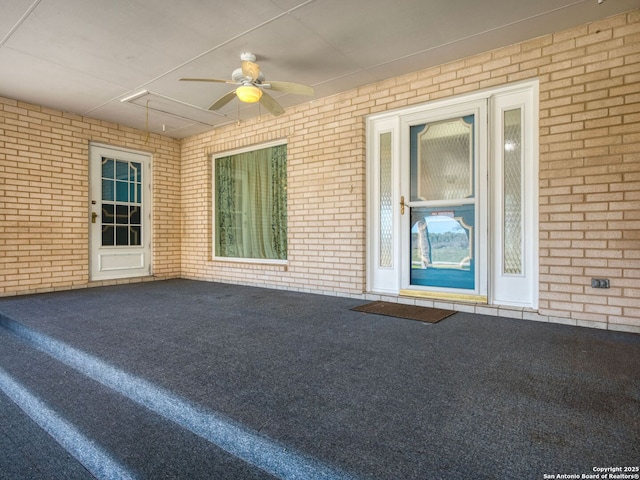 view of patio featuring ceiling fan