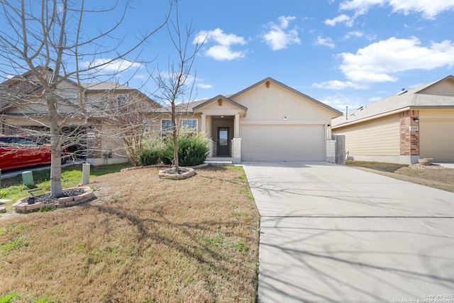 view of front of house with driveway, a front lawn, an attached garage, and stucco siding