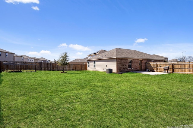 exterior space featuring a patio area, a fenced backyard, and central AC unit