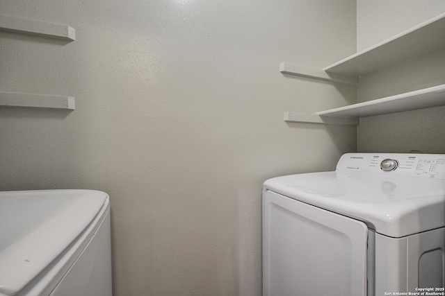 laundry area featuring laundry area and washer and clothes dryer