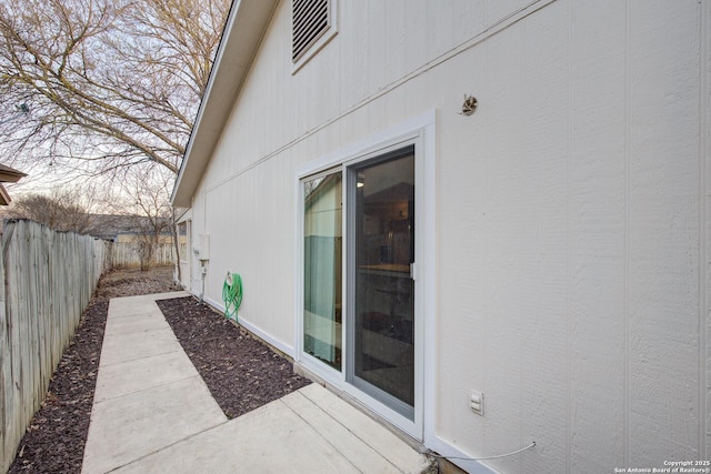 view of side of property with fence