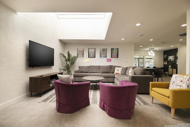 living room featuring baseboards, a skylight, visible vents, and recessed lighting