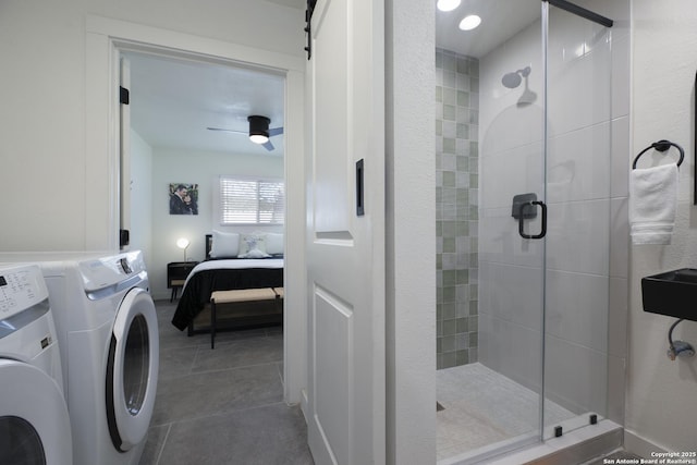 ensuite bathroom with a stall shower, ceiling fan, connected bathroom, and tile patterned floors