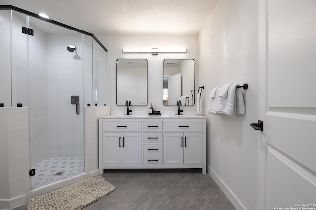 full bath featuring double vanity, a stall shower, and a sink