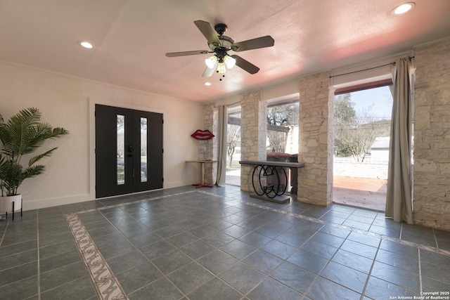 foyer with baseboards, french doors, crown molding, and recessed lighting