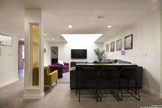 interior space featuring ornamental molding, recessed lighting, and baseboards