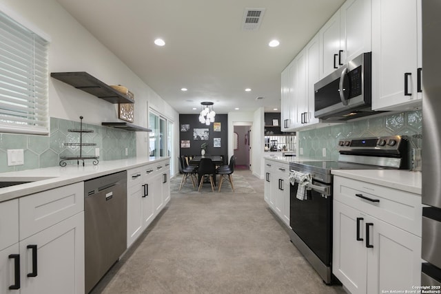 kitchen featuring open shelves, light countertops, visible vents, appliances with stainless steel finishes, and white cabinets