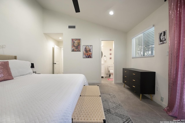 bedroom with baseboards, visible vents, vaulted ceiling, and ensuite bathroom