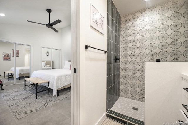 ensuite bathroom with ceiling fan, ensuite bath, tile patterned floors, walk in shower, and vanity