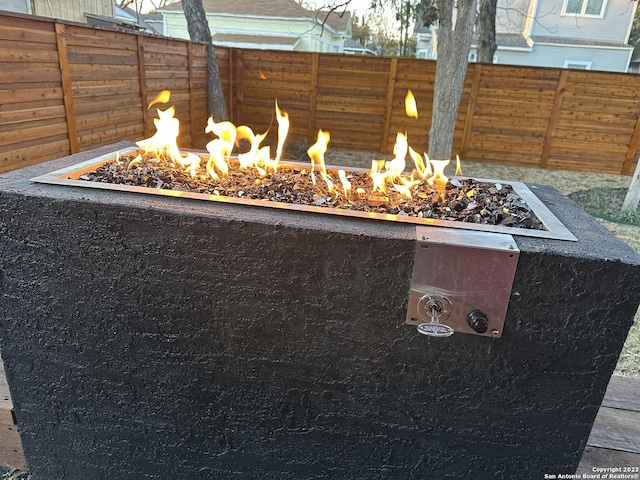 exterior details with fence and a fire pit