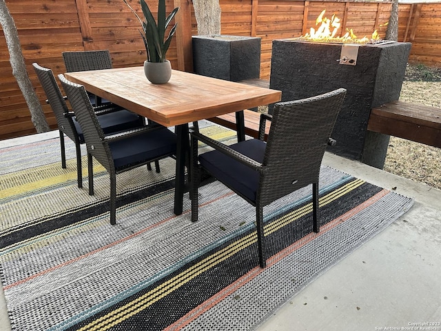 interior space featuring outdoor dining area and fence