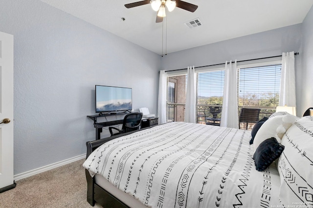 carpeted bedroom featuring a ceiling fan, visible vents, and baseboards