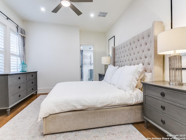 bedroom featuring recessed lighting, dark wood-style flooring, and visible vents