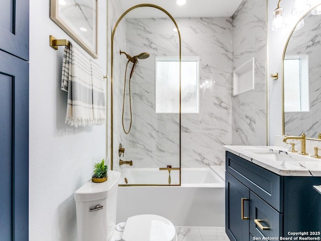 bathroom with toilet, vanity, shower / tub combination, and marble finish floor