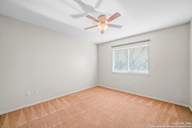 unfurnished room with light carpet and ceiling fan