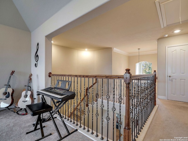 hall with crown molding, attic access, light carpet, an upstairs landing, and baseboards