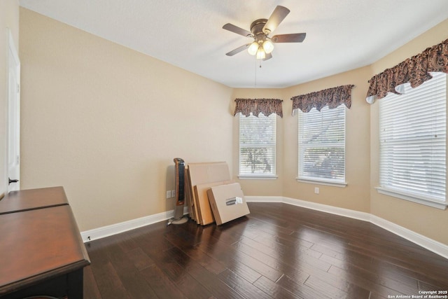 sitting room with baseboards, a ceiling fan, and wood finished floors