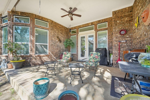 view of patio featuring a grill, a ceiling fan, and french doors