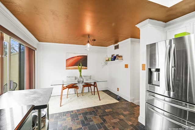 interior space with stone finish floor, visible vents, and baseboards