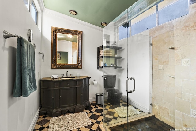 full bathroom featuring toilet, vanity, baseboards, ornamental molding, and a stall shower