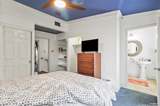 bedroom with baseboards, carpet flooring, visible vents, and crown molding