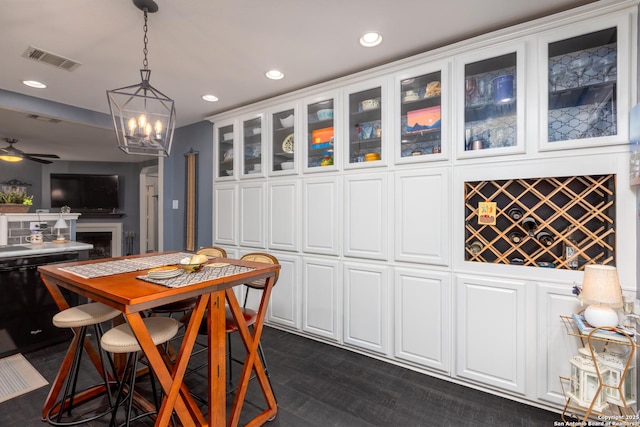 dining area featuring dark wood finished floors, a fireplace, recessed lighting, visible vents, and a ceiling fan