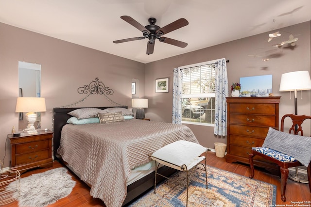 bedroom featuring wood finished floors and a ceiling fan