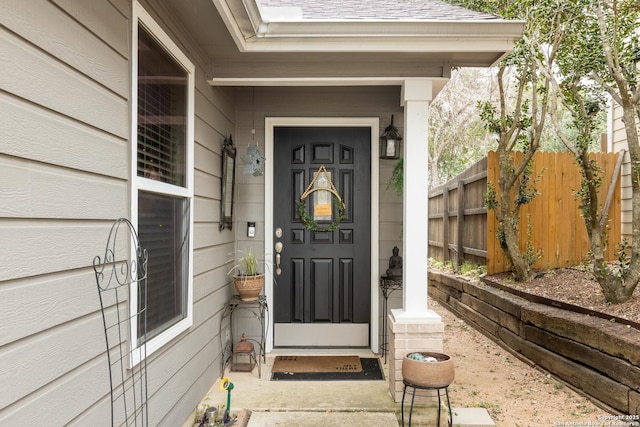 doorway to property with fence