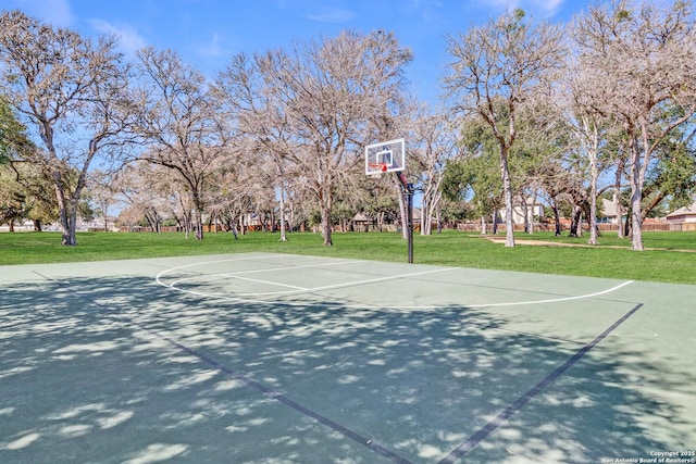 view of basketball court featuring a yard and community basketball court