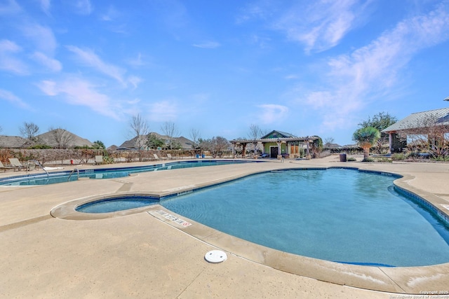 community pool featuring a patio, a jacuzzi, and a pergola