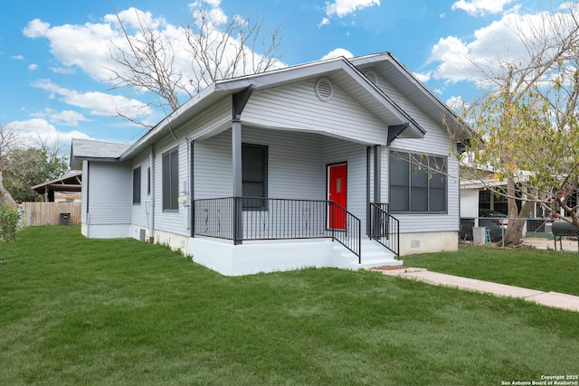 bungalow-style home featuring crawl space, covered porch, fence, and a front lawn