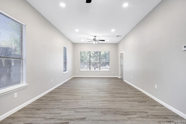 spare room with ceiling fan, baseboards, wood finished floors, and recessed lighting