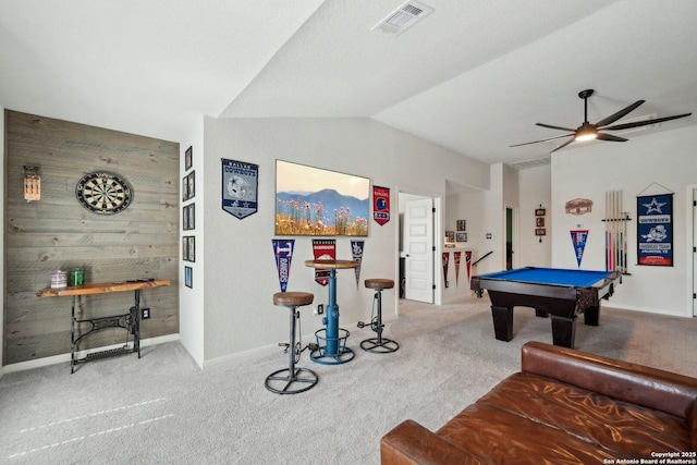 recreation room with lofted ceiling, wooden walls, carpet flooring, and pool table