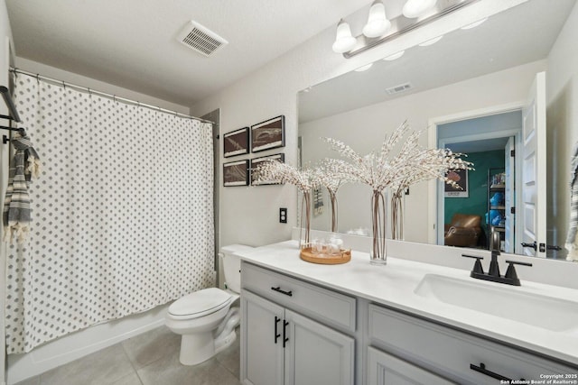 full bathroom with visible vents, vanity, toilet, and tile patterned floors