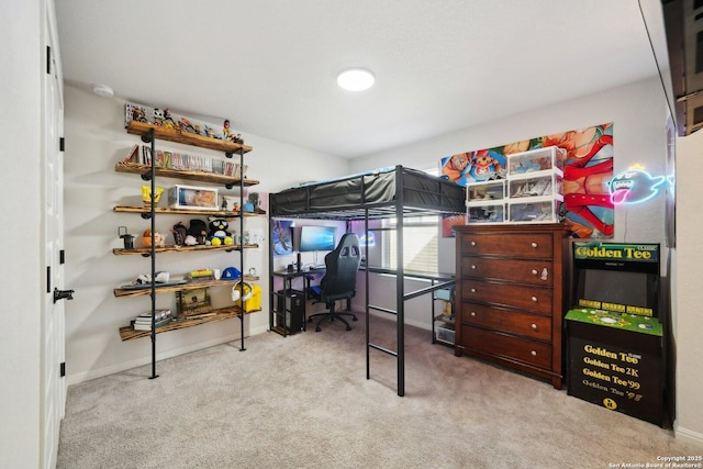 bedroom featuring baseboards and carpet flooring