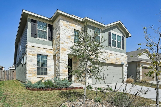 view of front of house featuring an attached garage, fence, stone siding, concrete driveway, and stucco siding